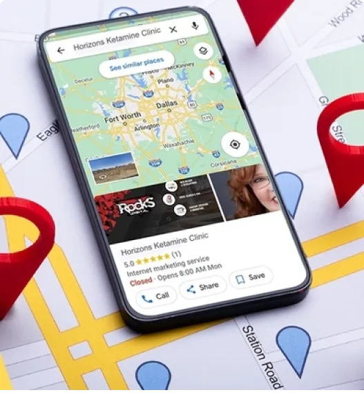 A smartphone displaying a map application with Horizons Ketamine Clinic's details appears to attract attention, its screen showing a map dotted with location markers. The phone rests on a paper map scattered with red pins, ideal for those struggling to find their way. - Ketamine